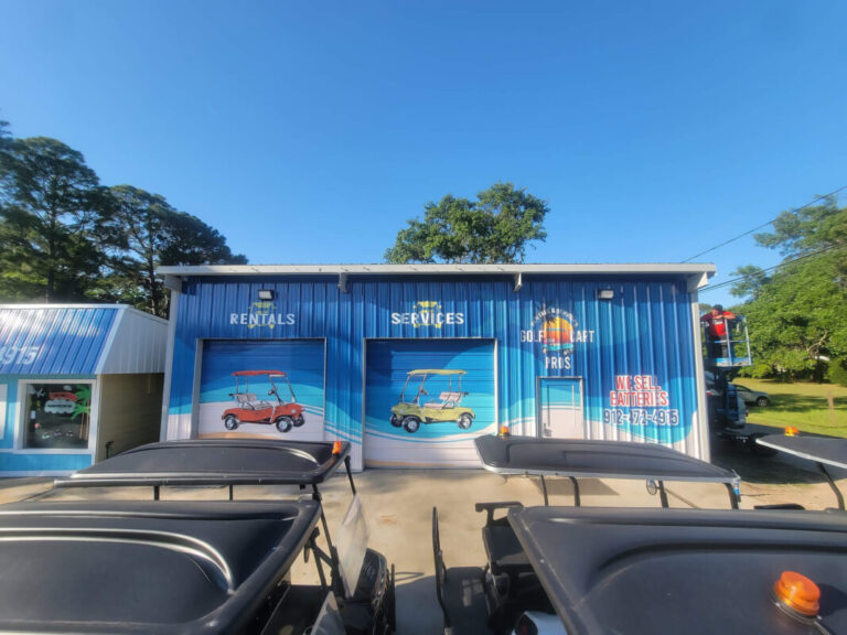 Storefront windows covered with colorful promotional graphics