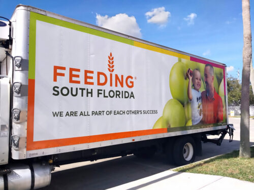 Feeding South Florida box truck wrapped with produce graphics and organization branding