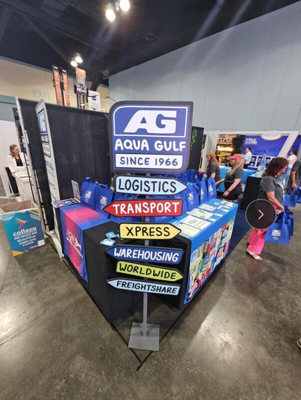 Aqua Gulf dimensional directional sign and branded table graphics at a Miami Beach Convention Center food show