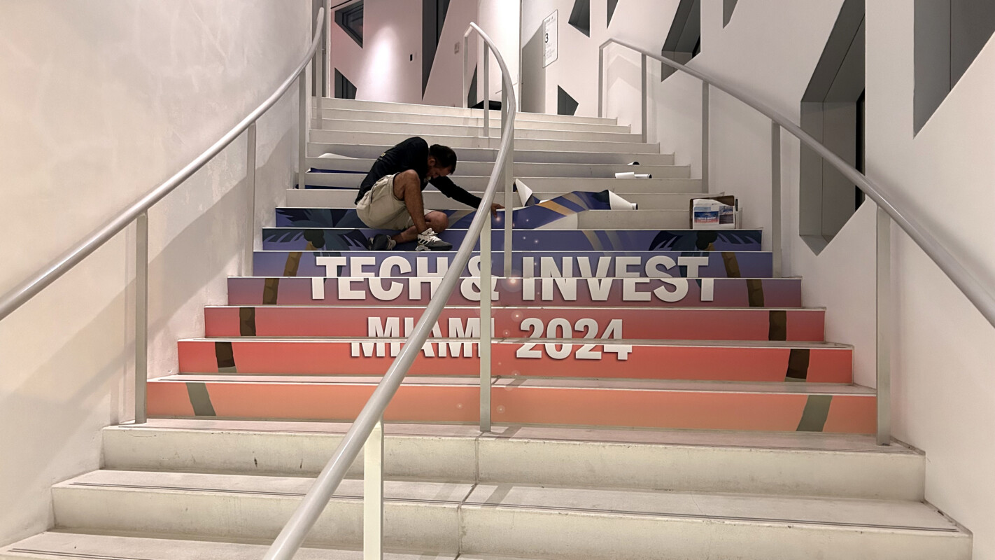 Tech and Invest Miami vinyl graphics installed across stair risers