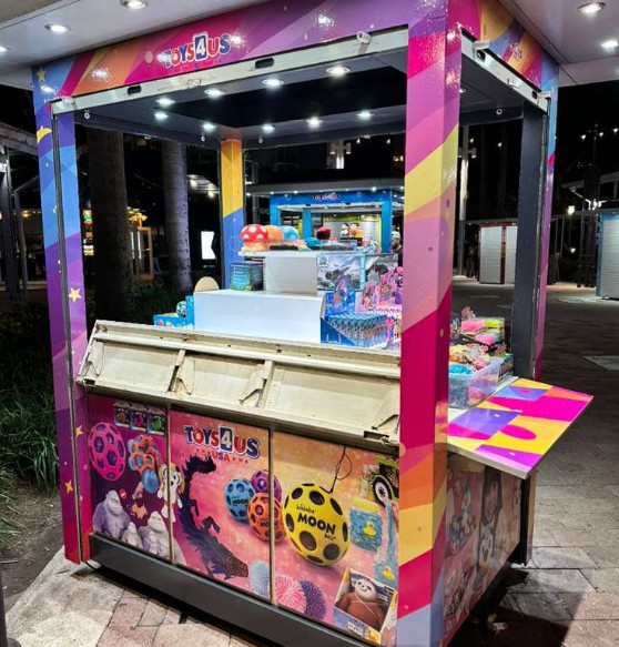Colorful custom printed Toys4Us kiosk panels and counter graphics for Miami activations