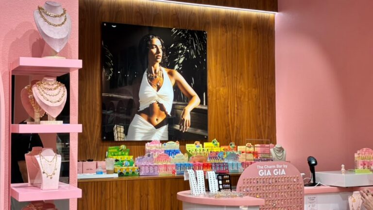 Oversized acrylic picture behind the Gia Gia store counter at Sawgrass Mills
